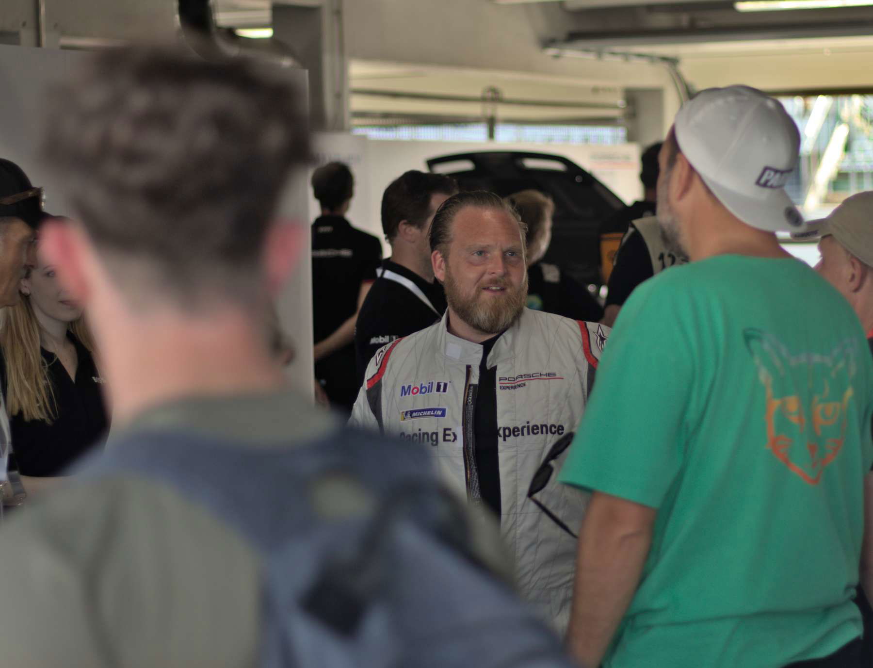Axel Stein talks to Paul Ripke at Porsche's Festival of Dreams before he goes off for a lap in the Cayman GT4 e-Performance