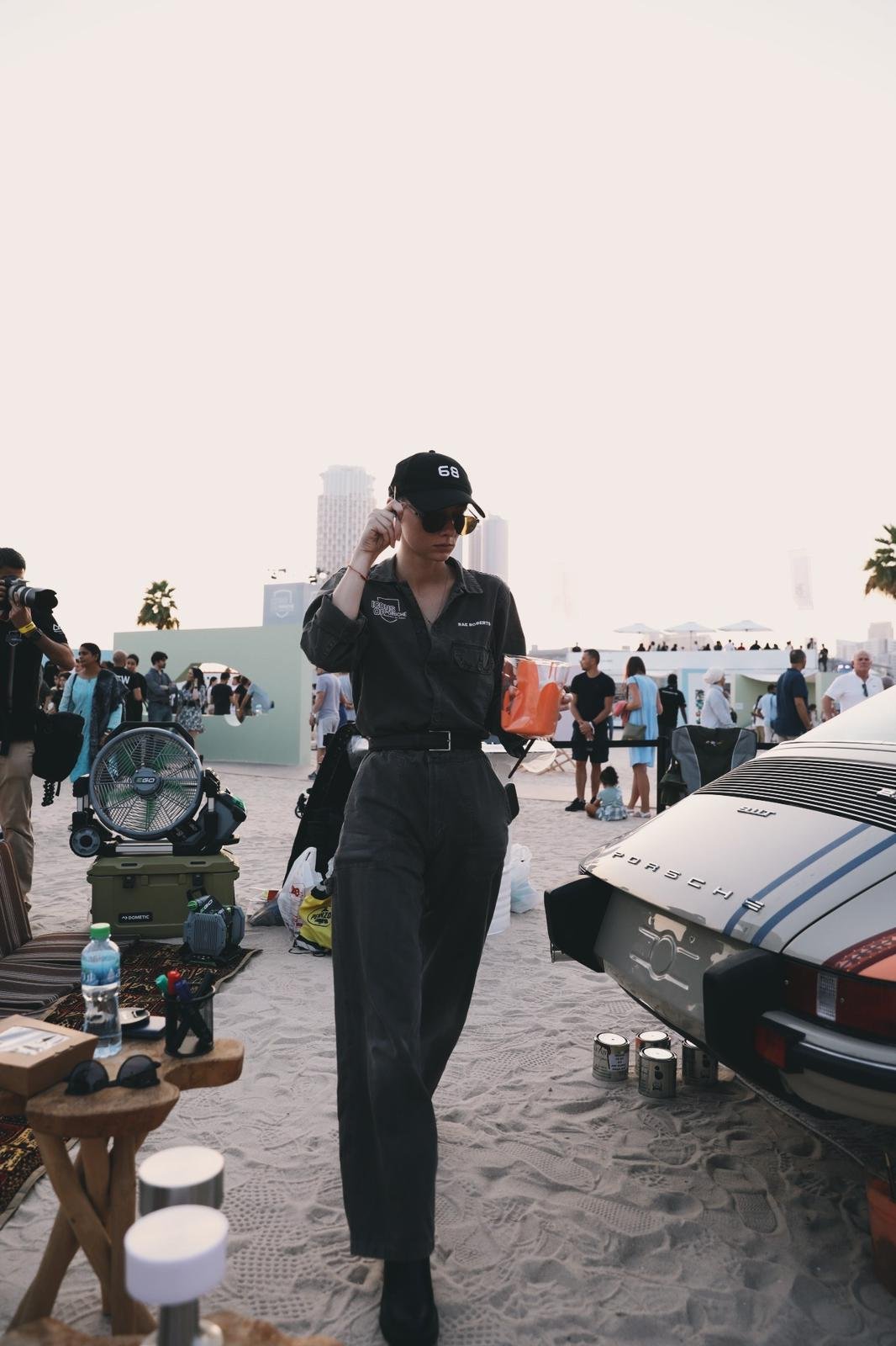 Florida-based painter Rae Roberts at the beach next to a Porsche 911 T