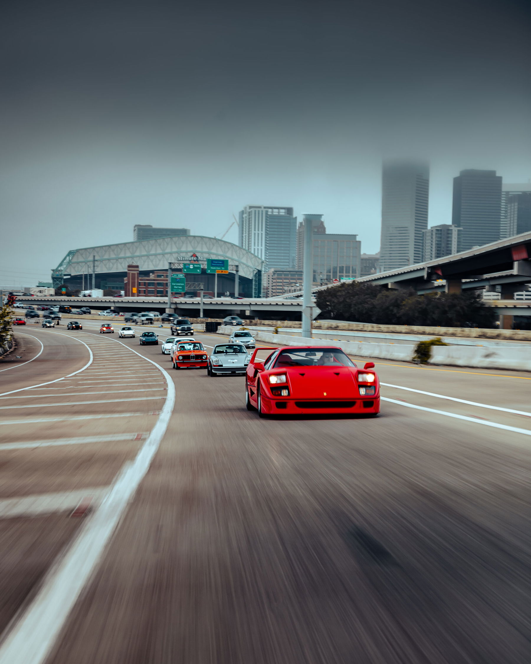 photo of a rally including Ferrari F40, Porsche 930, Lamborghini Countach by Kaitlyn Clink