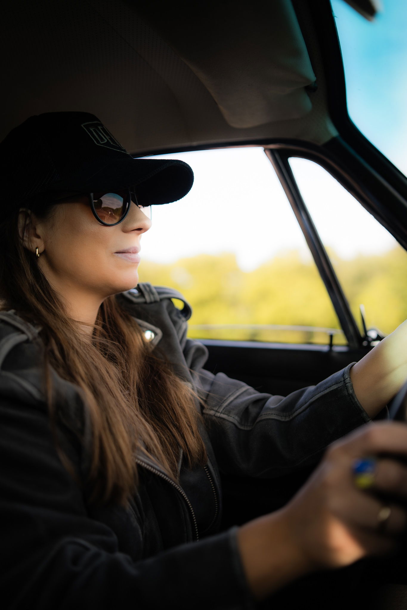 Birte Krause sitting driving her Porsche 912