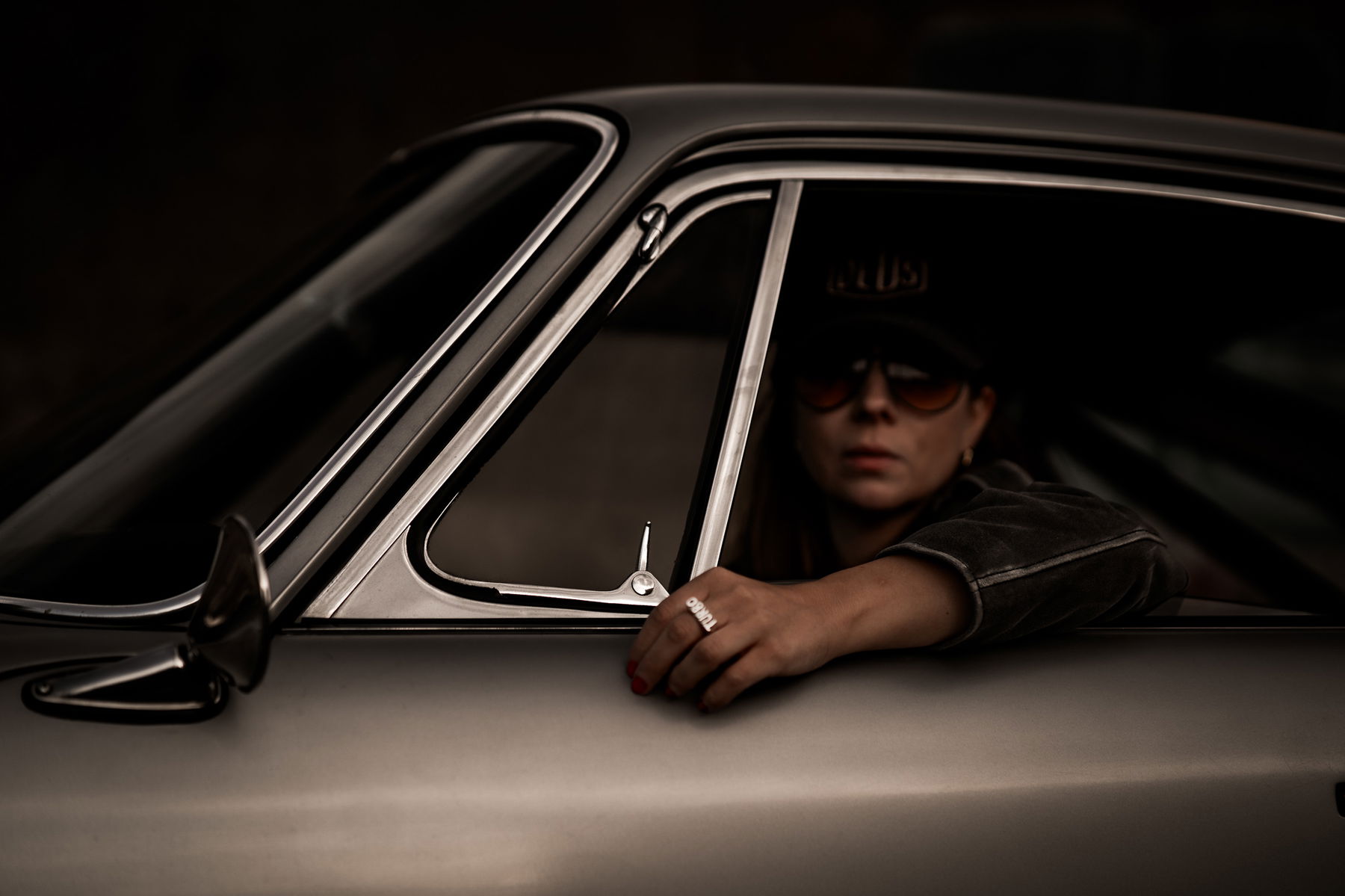 Birte Krause sitting in her Porsche 912