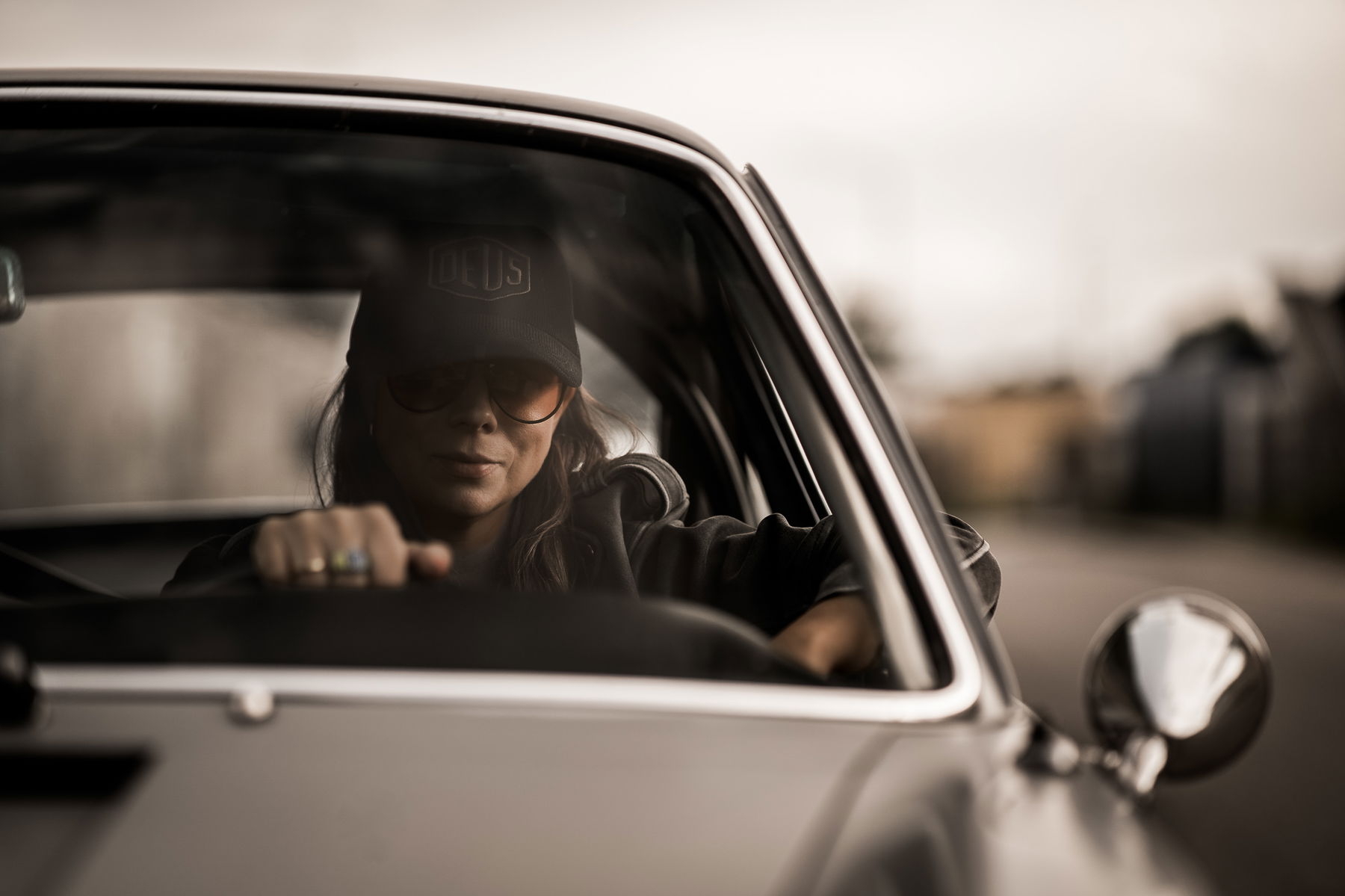 Birte Krause sitting in her Porsche 912