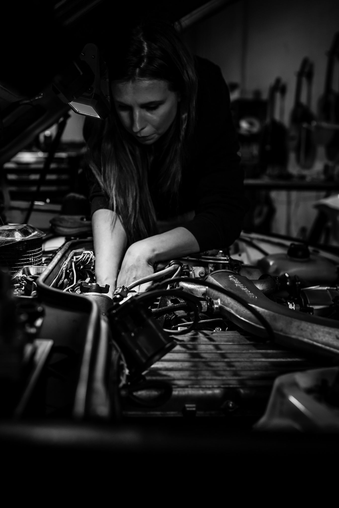 Birte Krause working on her Porsche 924 Turbo engine