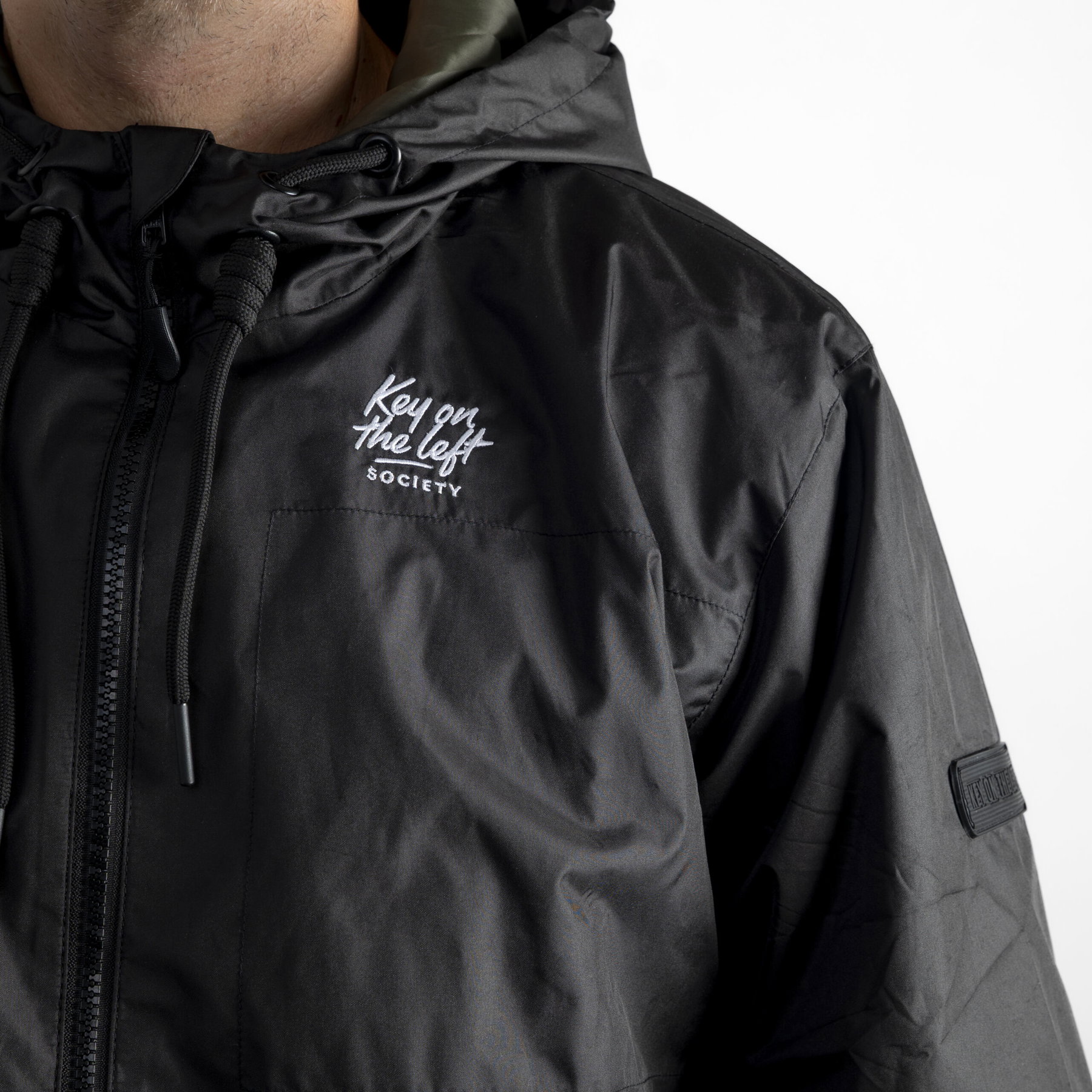 Key on the Left – Windbreaker Jacket (Unisex) - elferspot.com