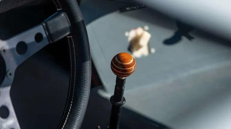 Why do Porsches have the key on the left?